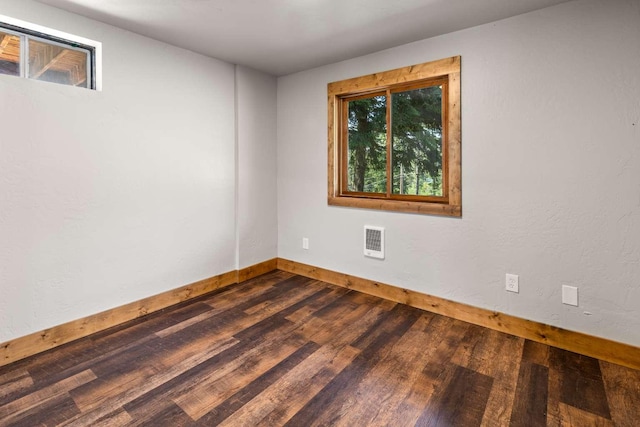 32785 Linden Ln, Bigfork, MT 59911 - unfurnished room featuring baseboards and dark wood finished floors
