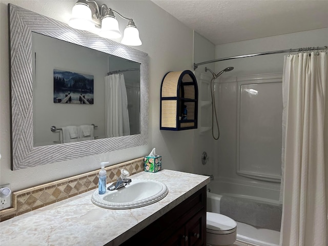 67 Crestwood Dr Unit A, Whitefish, MT 59937 - full bathroom featuring vanity, shower / tub combo with curtain, and a textured ceiling