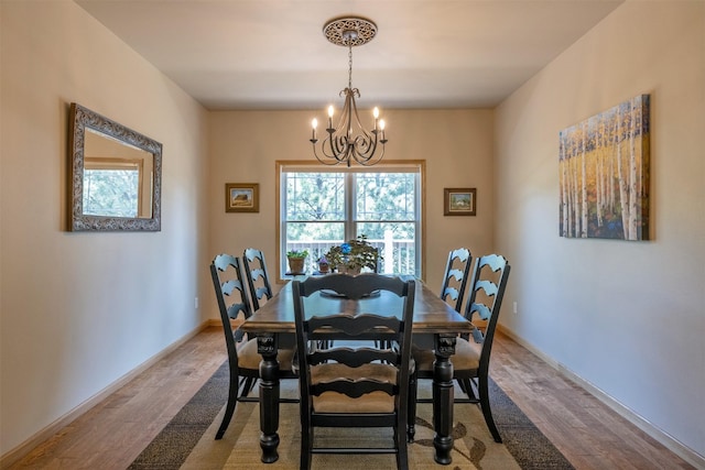 13 Crossfire Dr, Clancy, MT 59634 - dining room with a chandelier, wood finished floors, and plenty of natural light
