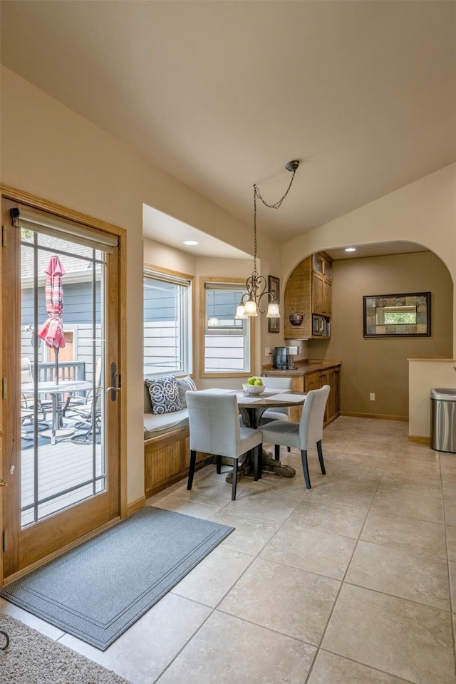 13 Crossfire Dr, Clancy, MT 59634 - dining room with arched walkways, light tile patterned floors, and healthy amount of natural light