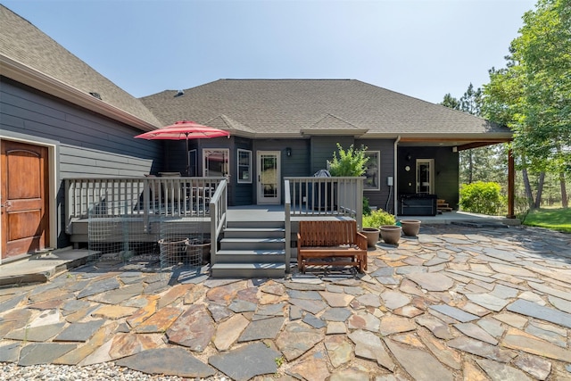 13 Crossfire Dr, Clancy, MT 59634 - rear view of house featuring a patio, a wooden deck, and roof with shingles