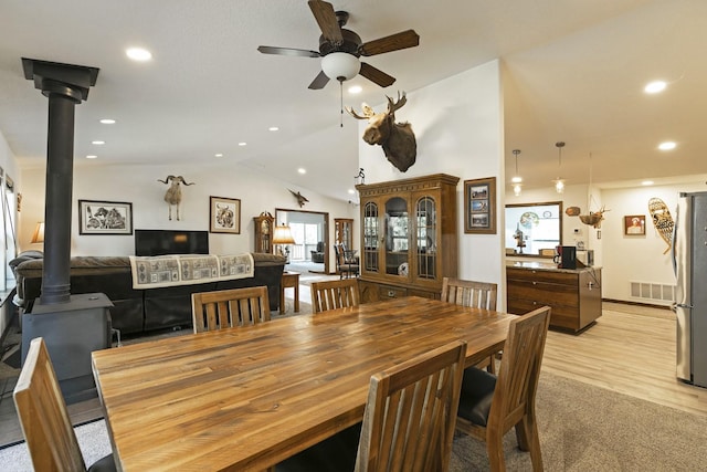3979 Evenson Ln, Stevensville, MT 59870 - dining room featuring lofted ceiling, ceiling fan, recessed lighting, and light wood-type flooring