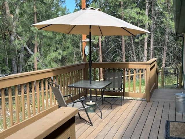 3979 Evenson Ln, Stevensville, MT 59870 - wooden deck featuring outdoor dining area
