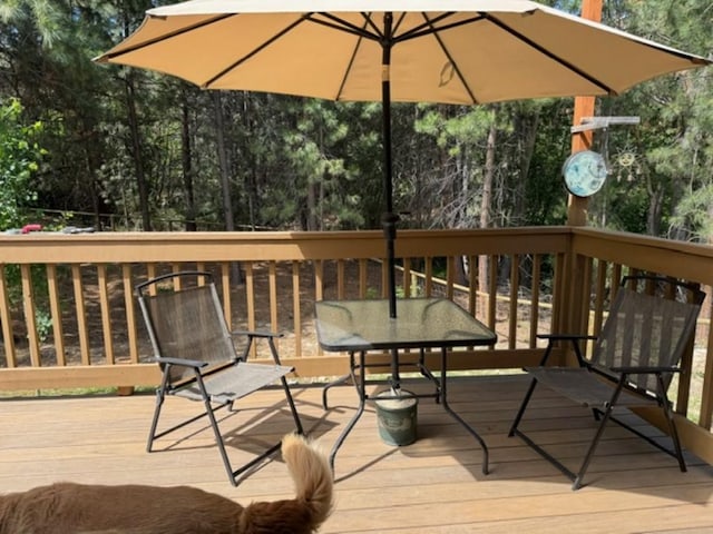 3979 Evenson Ln, Stevensville, MT 59870 - wooden deck featuring view of wooded area
