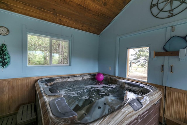 3979 Evenson Ln, Stevensville, MT 59870 - bedroom featuring lofted ceiling, multiple windows, wood ceiling, and wainscoting