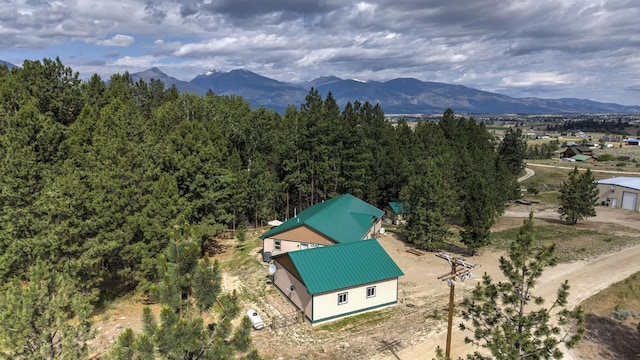 3979 Evenson Ln, Stevensville, MT 59870 - view from above of property featuring a mountain backdrop and a heavily wooded area