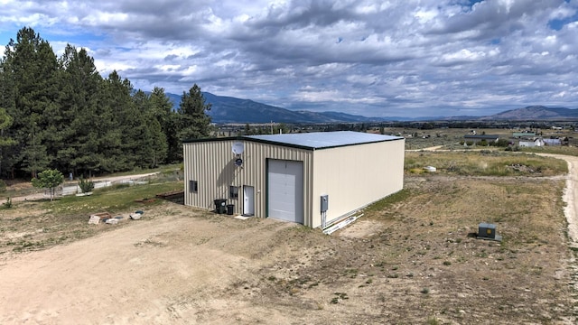 3979 Evenson Ln, Stevensville, MT 59870 - view of outbuilding featuring a mountain view and driveway