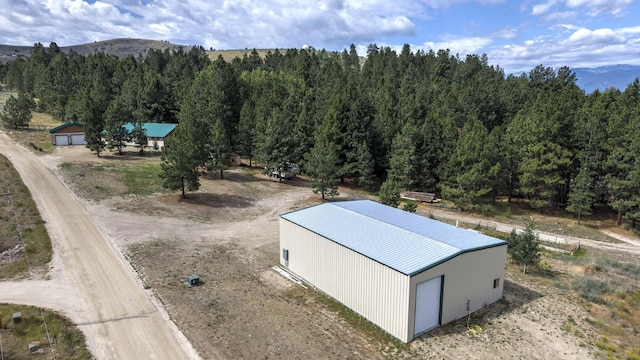 3979 Evenson Ln, Stevensville, MT 59870 - view from above of property with a mountain backdrop and a heavily wooded area