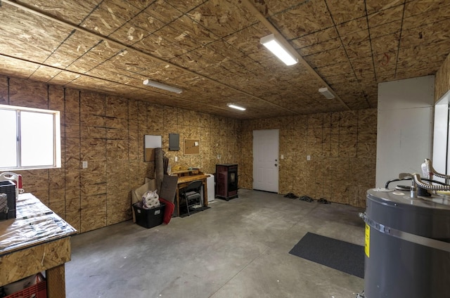 3979 Evenson Ln, Stevensville, MT 59870 - misc room featuring concrete flooring, water heater, and electric panel