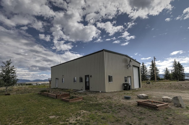 3979 Evenson Ln, Stevensville, MT 59870 - view of outdoor structure with a garden and a mountain view