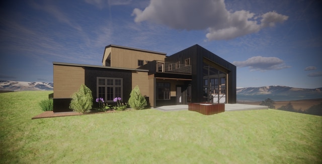 164 River Ranch Rd, Whitefish, MT 59937 - back of property featuring a lawn, a balcony, and a mountain view