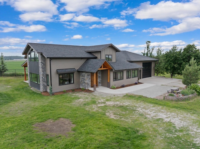1244 S Wintercrest Dr, Kalispell, MT 59901 - contemporary house with driveway, a front lawn, a garage, roof with shingles, and board and batten siding