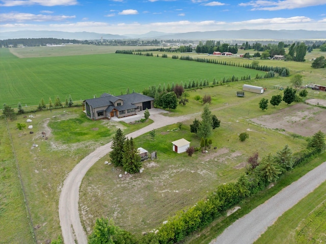 1244 S Wintercrest Dr, Kalispell, MT 59901 - aerial view of sparsely populated area featuring a mountain backdrop and large plots for crops