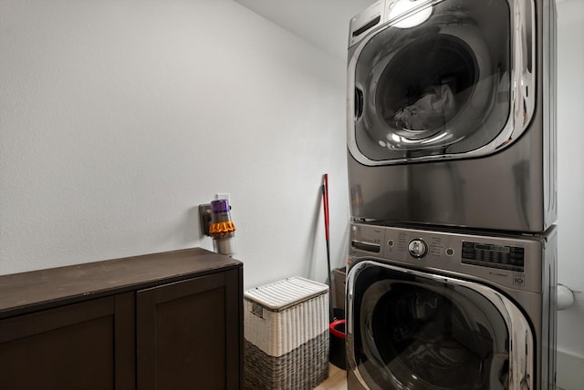 1244 S Wintercrest Dr, Kalispell, MT 59901 - laundry room with stacked washer and clothes dryer and cabinet space