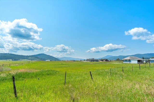 3250 US Highway 2 W, Kalispell, MT 59901 - view of mountain backdrop featuring rural landscape and a pastoral area