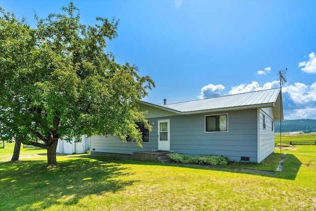 3250 US Highway 2 W, Kalispell, MT 59901 - view of front facade with a front yard, a metal roof, and crawl space