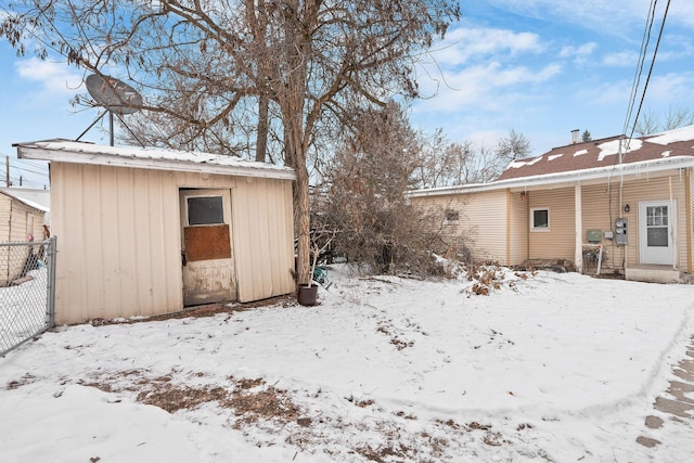 426 2nd Ave E, Kalispell, MT 59901 - yard covered in snow featuring a storage unit