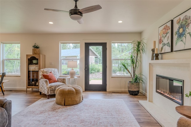 405 Kendal Loop, Kalispell, MT 59901 - living room with a premium fireplace, wood finished floors, recessed lighting, and a ceiling fan