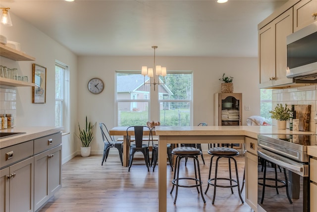405 Kendal Loop, Kalispell, MT 59901 - dining space featuring light wood-type flooring, a chandelier, and recessed lighting