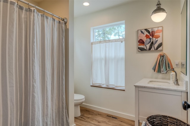 405 Kendal Loop, Kalispell, MT 59901 - bathroom featuring vanity, wood finished floors, recessed lighting, and a shower with curtain