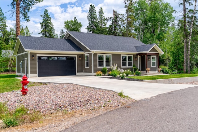 405 Kendal Loop, Kalispell, MT 59901 - ranch-style home featuring a garage, driveway, and roof with shingles