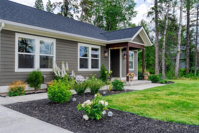 405 Kendal Loop, Kalispell, MT 59901 - view of front of house featuring a front yard and a shingled roof