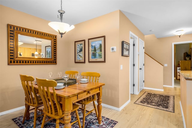 1750 E Lakeshore Dr Unit 212, Whitefish, MT 59937 - dining space featuring baseboards and light wood finished floors