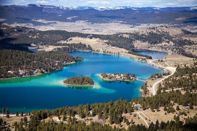 37 Roybals Way, Kalispell, MT 59901 - aerial view of a water and mountain view and a heavily wooded area