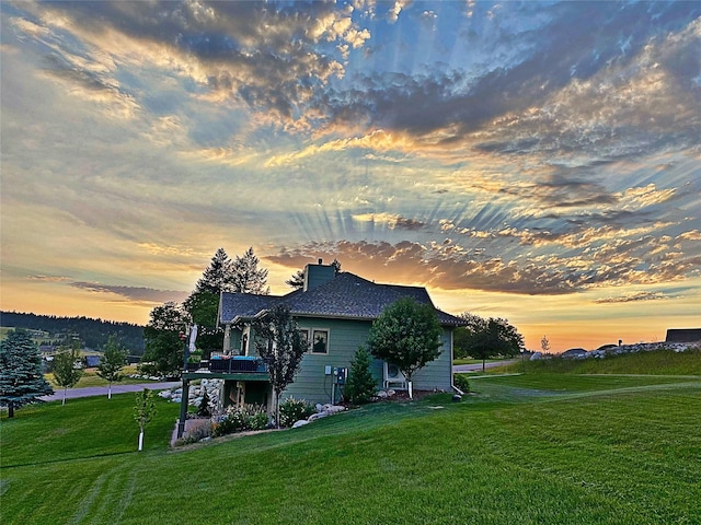 37 Roybals Way, Kalispell, MT 59901 - view of side of home with a lawn and a chimney
