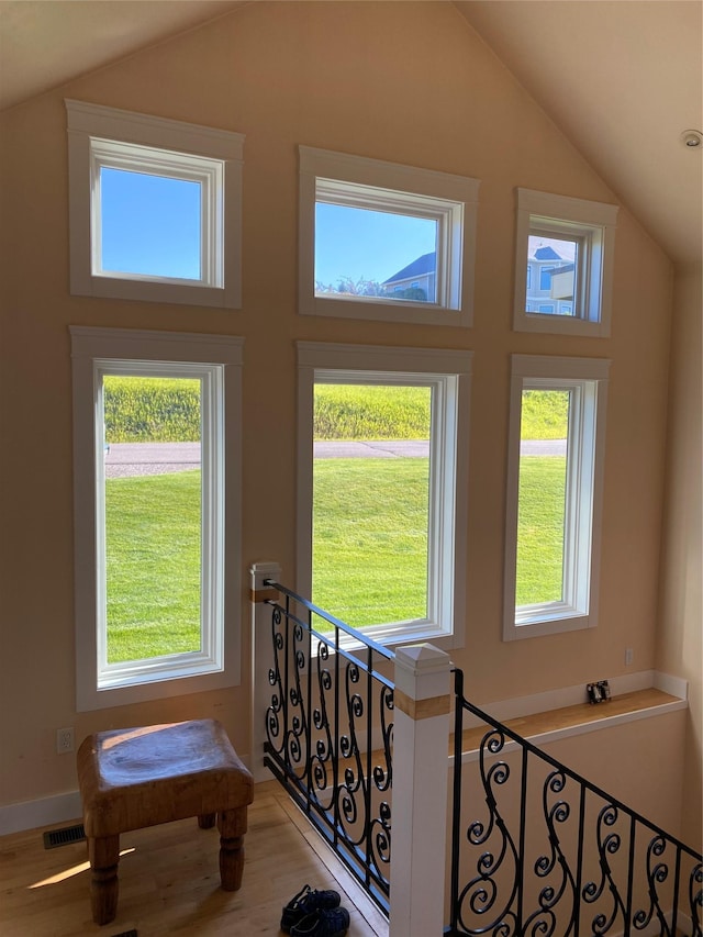 37 Roybals Way, Kalispell, MT 59901 - doorway featuring lofted ceiling, healthy amount of natural light, and wood finished floors