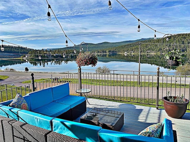 37 Roybals Way, Kalispell, MT 59901 - wooden deck featuring outdoor lounge area and a water and mountain view
