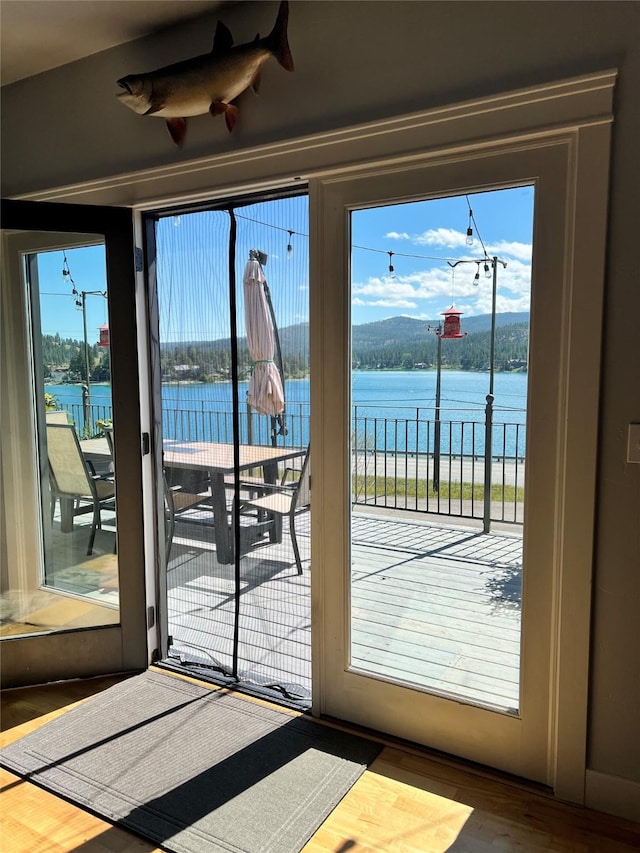 37 Roybals Way, Kalispell, MT 59901 - doorway to outside with a water view and wood finished floors