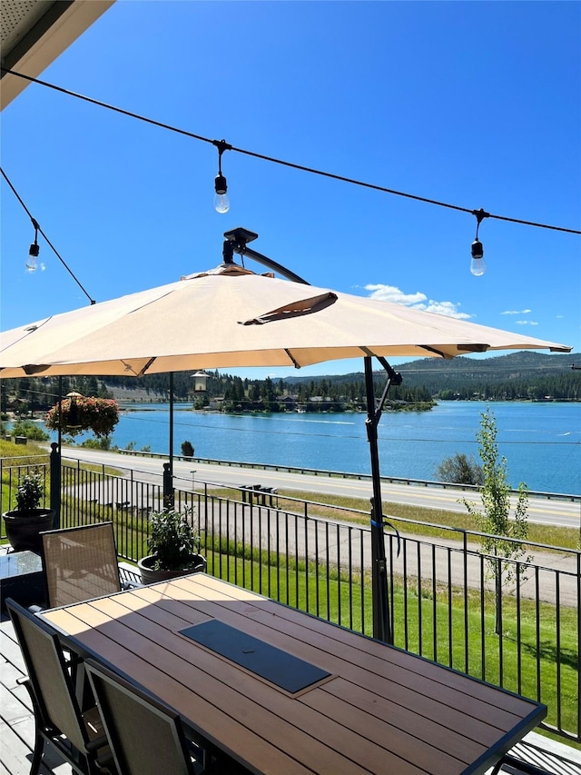 37 Roybals Way, Kalispell, MT 59901 - deck with a water view and outdoor dining area