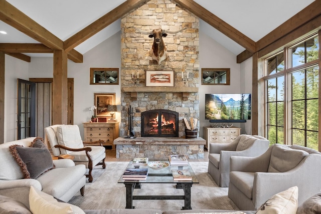 176 Whitefish Hills Loop, Whitefish, MT 59937 - living area with beamed ceiling, a fireplace, wood finished floors, and high vaulted ceiling