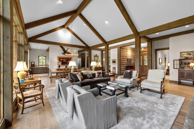 176 Whitefish Hills Loop, Whitefish, MT 59937 - living room with a chandelier, beamed ceiling, light wood-type flooring, and high vaulted ceiling