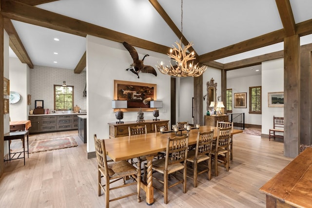 176 Whitefish Hills Loop, Whitefish, MT 59937 - dining space featuring beam ceiling, a chandelier, light wood finished floors, and recessed lighting