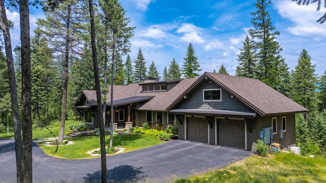 176 Whitefish Hills Loop, Whitefish, MT 59937 - view of front of house featuring a garage, a front lawn, and driveway