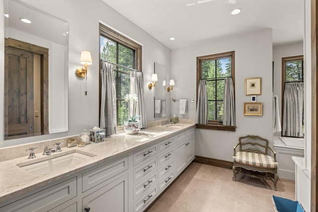 176 Whitefish Hills Loop, Whitefish, MT 59937 - full bath with plenty of natural light, double vanity, recessed lighting, and tile patterned flooring