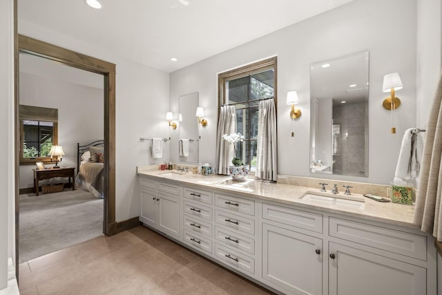 176 Whitefish Hills Loop, Whitefish, MT 59937 - full bathroom featuring double vanity, ensuite bath, recessed lighting, and tile patterned floors
