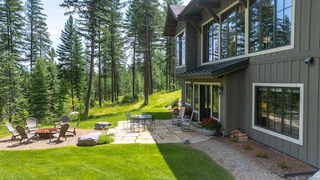 176 Whitefish Hills Loop, Whitefish, MT 59937 - view of green lawn featuring a fire pit and a patio