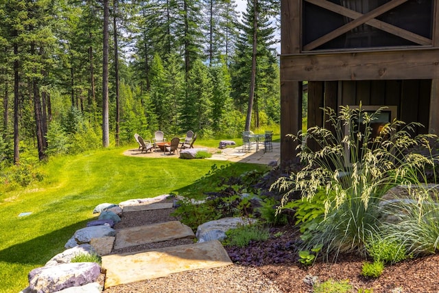 176 Whitefish Hills Loop, Whitefish, MT 59937 - view of green lawn featuring a fire pit and a patio