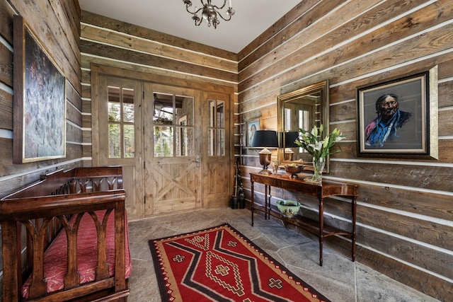 176 Whitefish Hills Loop, Whitefish, MT 59937 - entrance foyer featuring wooden walls and a chandelier