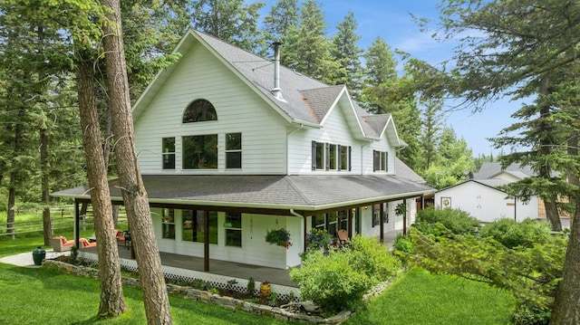 745 Capistrano Dr, Kalispell, MT 59901 - back of property with roof with shingles and covered porch