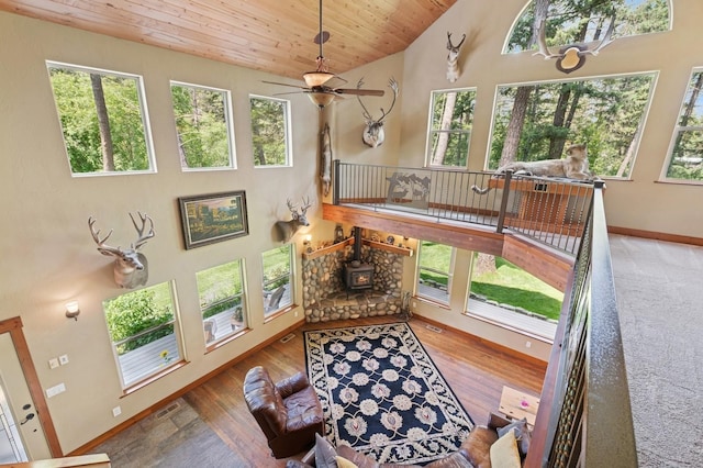 745 Capistrano Dr, Kalispell, MT 59901 - living room with lofted ceiling, wood ceiling, ceiling fan, and wood finished floors