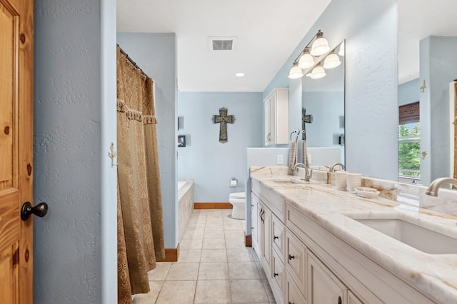 745 Capistrano Dr, Kalispell, MT 59901 - full bath featuring double vanity, tile patterned floors, a tub to relax in, a textured wall, and a shower with curtain