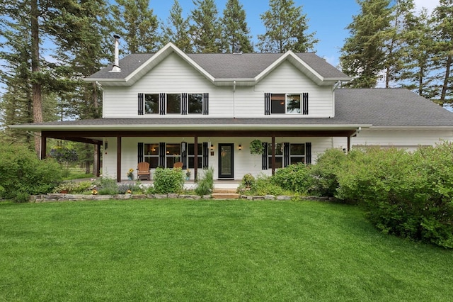 745 Capistrano Dr, Kalispell, MT 59901 - view of front of house with covered porch, a front lawn, and a shingled roof