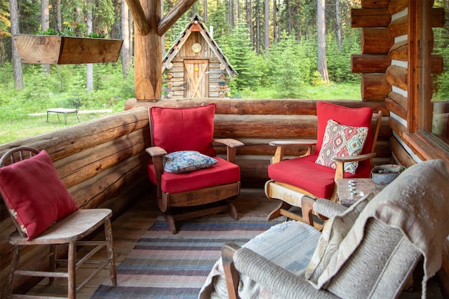 235 Red Meadow Rd, Polebridge, MT 59928 - deck featuring a wooded view