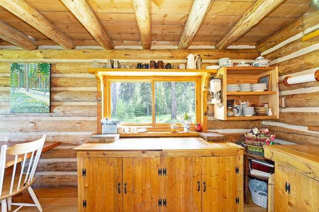 235 Red Meadow Rd, Polebridge, MT 59928 - kitchen with a wooden ceiling with exposed beams, log walls, wood finished floors, and open shelves