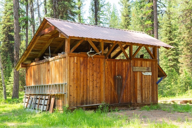 235 Red Meadow Rd, Polebridge, MT 59928 - view of outdoor structure featuring a forest view