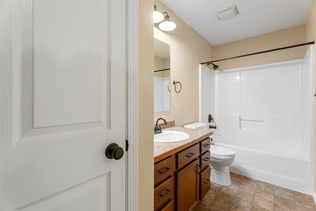 4012 Lancaster Rd, Missoula, MT 59808 - bathroom featuring vanity, shower / bathtub combination, and stone finish floors